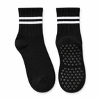Black striped Pilates grip socks, matching pair, front view