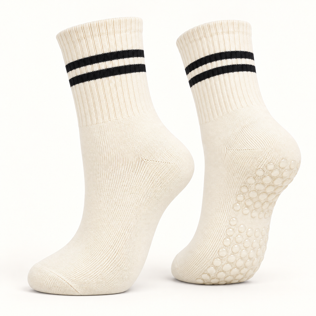 Ivory striped Pilates grip socks, angled pair showing the grip dots