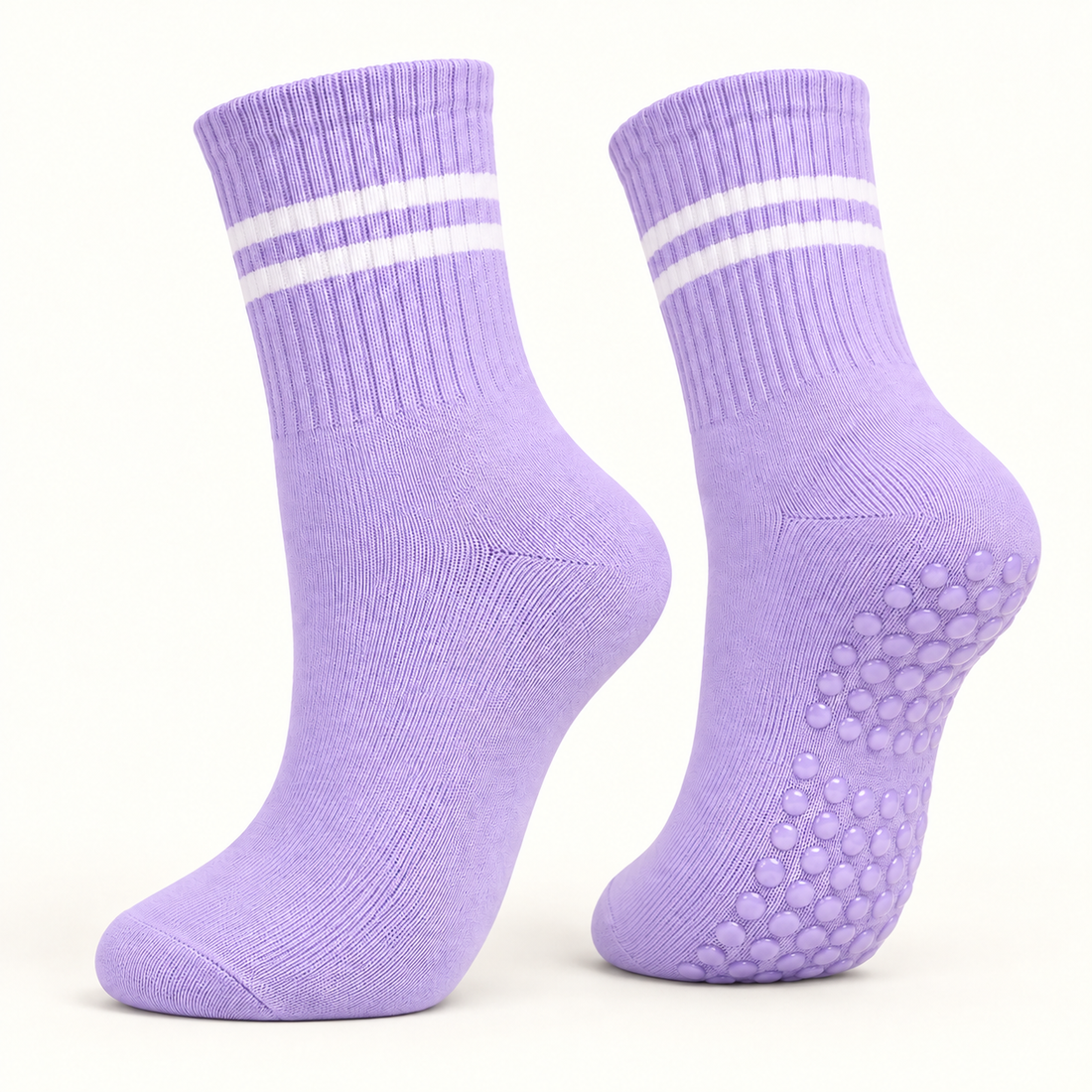 Lavender striped Pilates grip socks, angled pair showing the grip dots