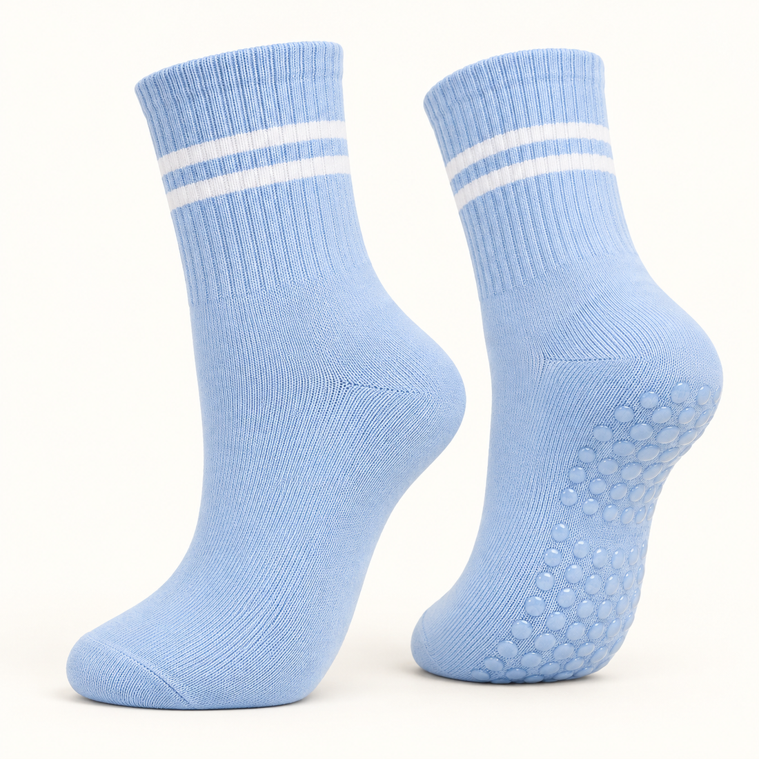 Light Blue striped Pilates grip socks, angled pair showing the grip dots