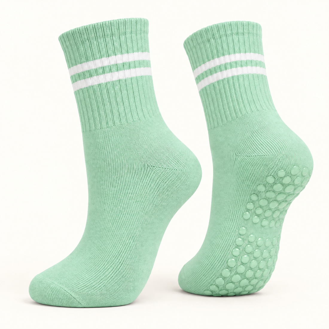 Mint Green striped Pilates grip socks, angled pair showing the grip dots