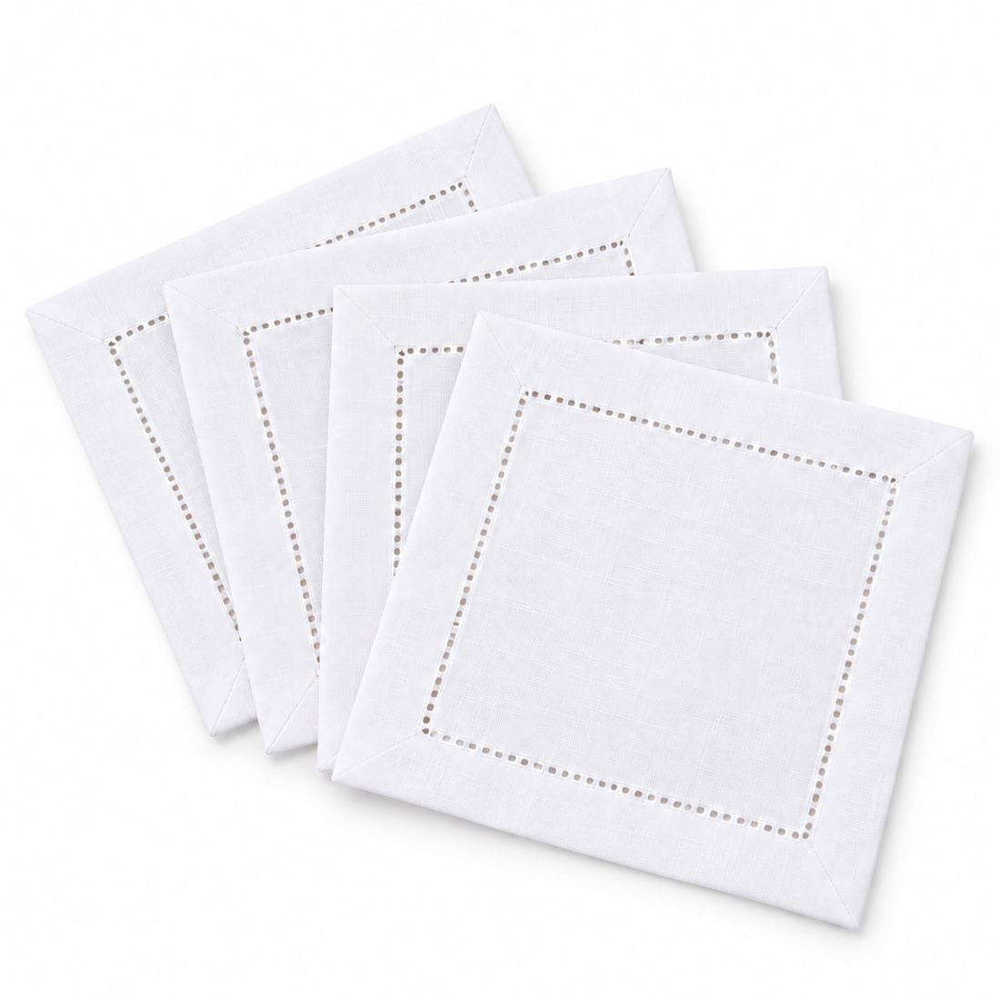 Set of four white hemstitch cocktail napkins, fanned out