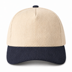 Cream and navy two-tone corduroy trucker hat, front view